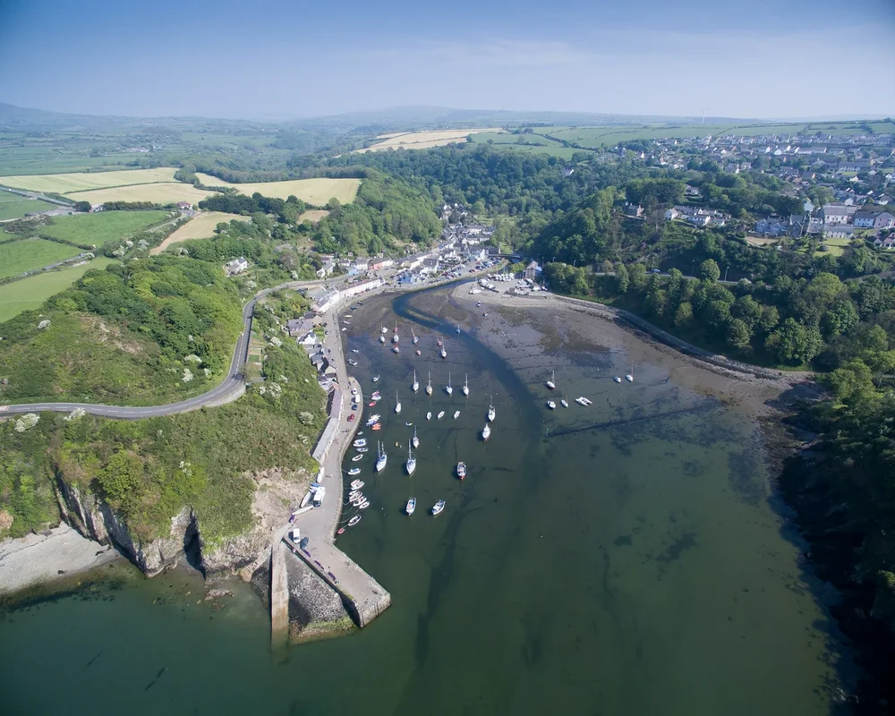 An Aerial View of a Harbour with Boats in The Water